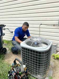 Man Working on an Outdoor Air Conditioning Unit